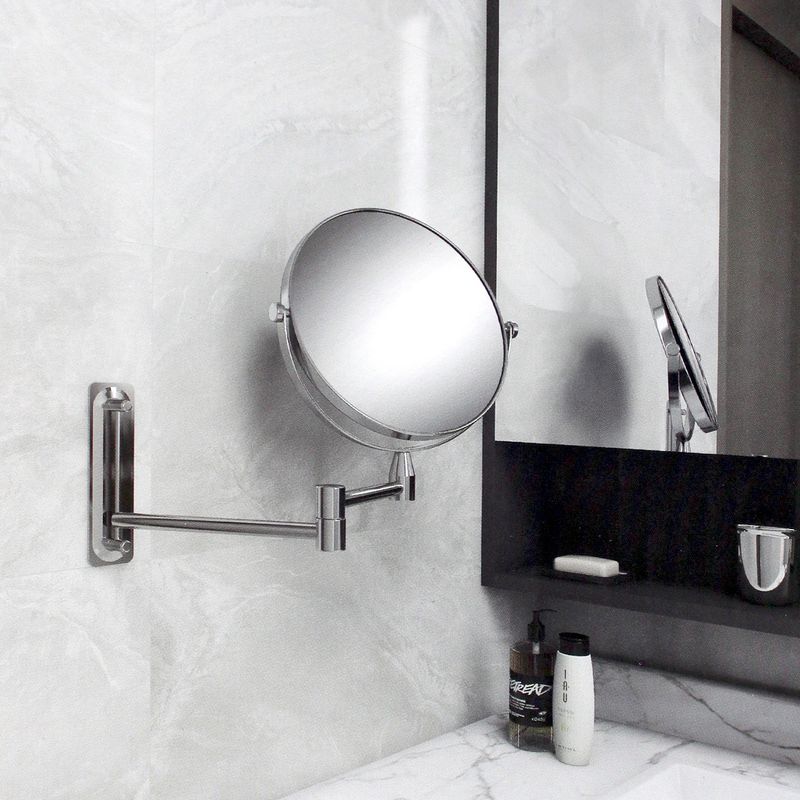 Espejo-de-baño-doble-cara-redondo-con-base-de-anclaje-a-pared-y-brazo-metalico-extensible.-Diseño-sin-bordes.