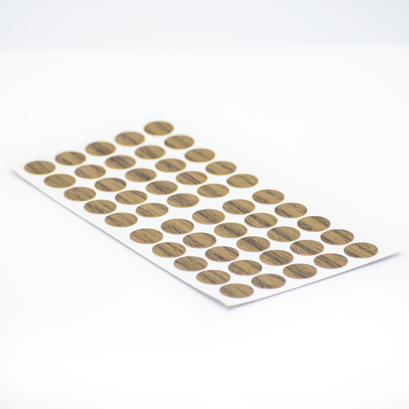Tapa-Adhesiva-Caramelo-diseñada-para-cubrir-y-disimular-los-orificios-o-cabezas-de-tornillos-en-tableros-de-madera
