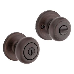 Cerradura para dormitorio con llave BRONCE VENECIANO COVE con tecnología antibacterial. - KWIKSET